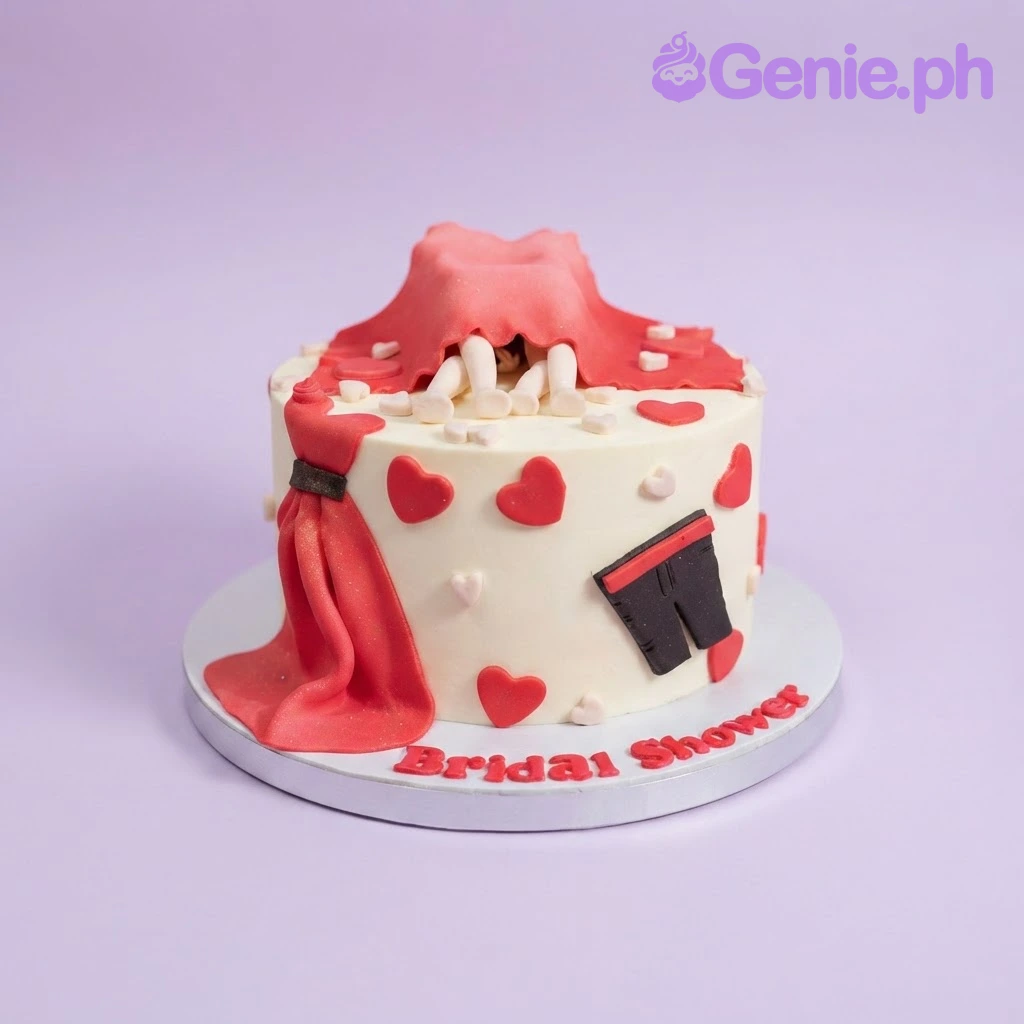 Bridal Shower Ivory Cake Ivory 1-tier bridal shower cake with a sculpted couple under a red sheet, red hearts, and matching message