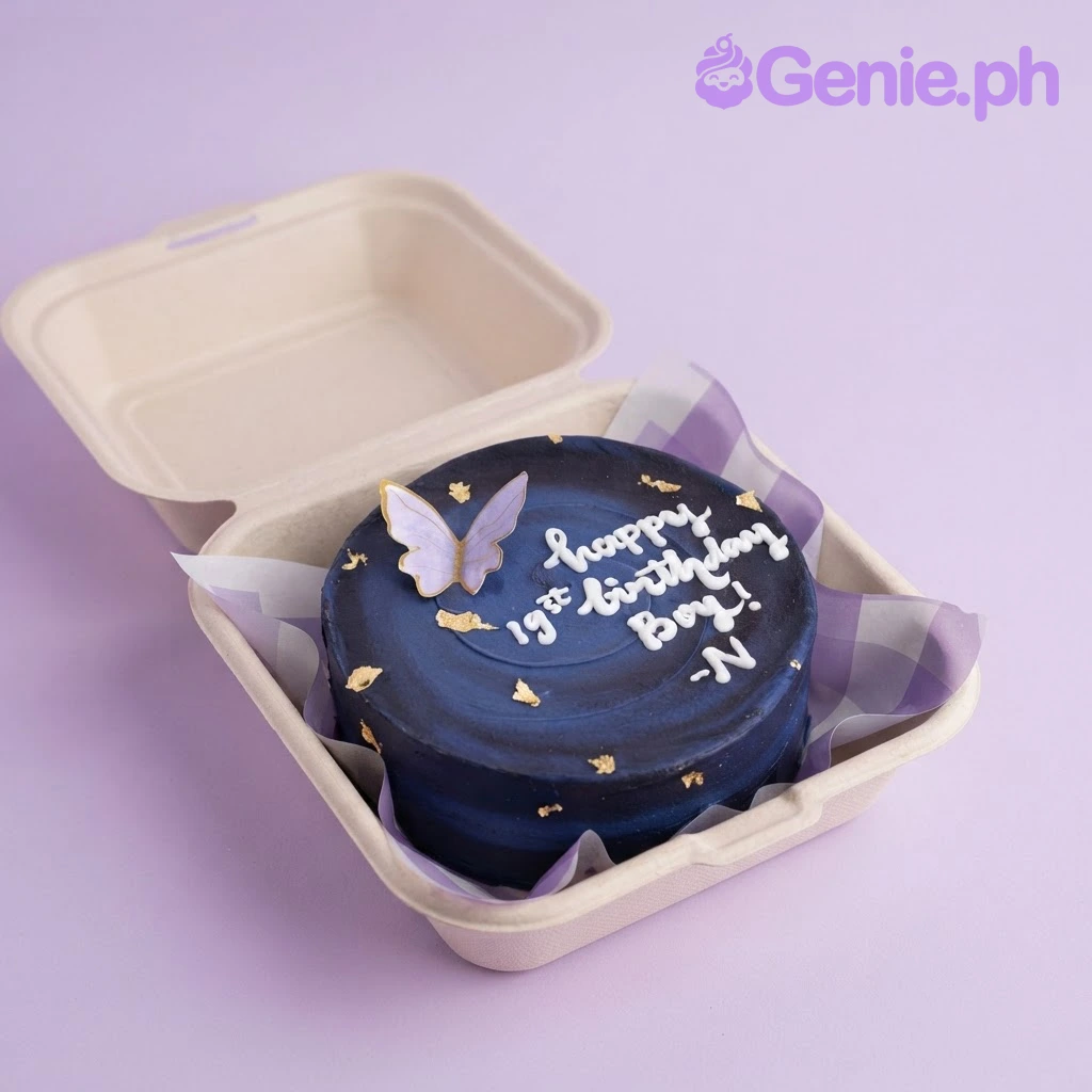 Galaxy Bento Purple Butterfly Cake Purple and navy bento cake with soft gradient icing, a purple butterfly topper, and gold leaf flakes