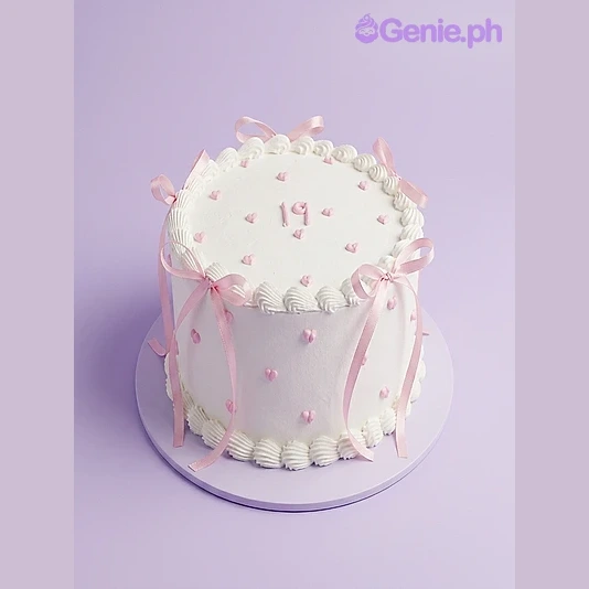 19th Birthday White Cake White 1-tier birthday cake with pink ribbons and small pink hearts