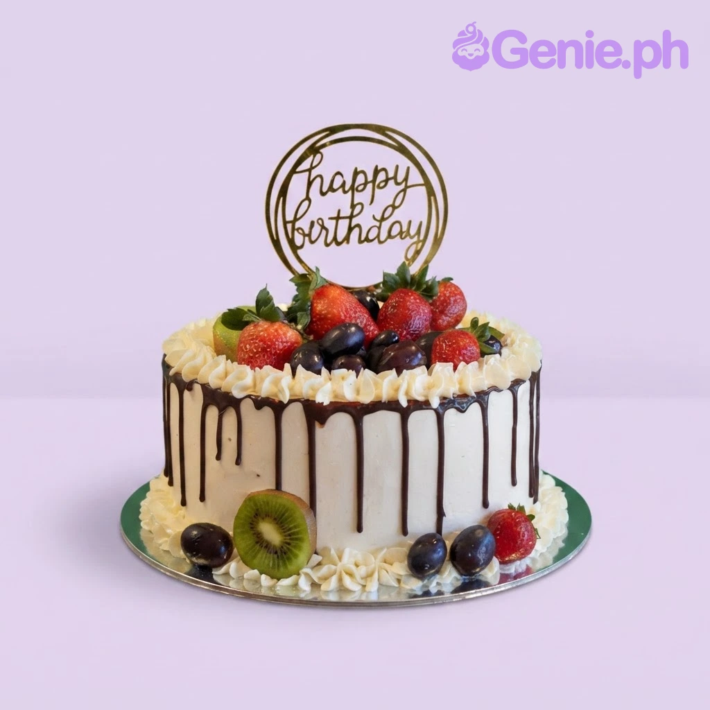 Fruit Drip White Birthday Cake White 1 tier soft icing birthday cake with chocolate drip, fresh strawberries, grapes, kiwi, and a gold happy birthday sign