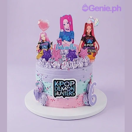 Kpop-Inspired Theme Birthday Cake Pastel gradient 1-tier cake with K-pop character printouts, a name banner, glittery stars, and a number 6 topper