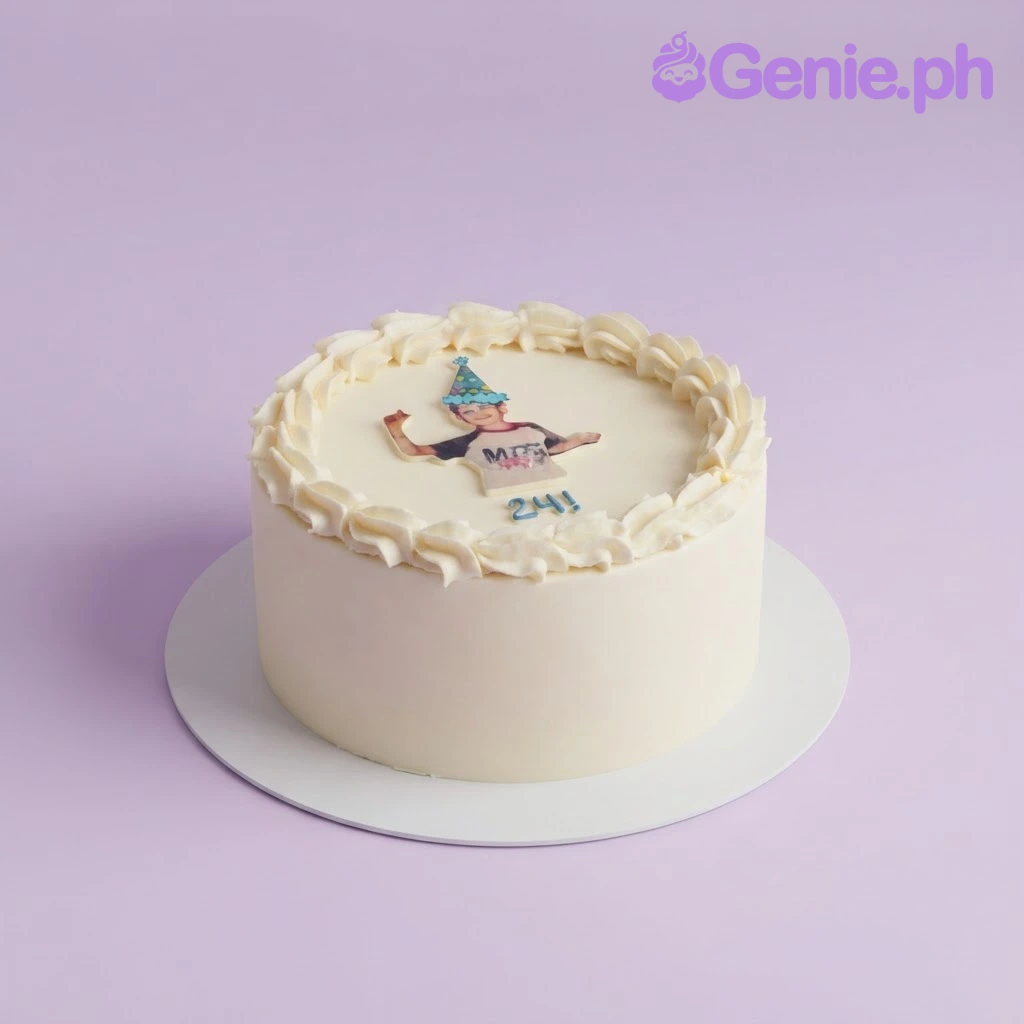 Birthday Photo White Cake White 1-tier cake with soft icing, a piped border, a photo printout of a person in a party hat, and blue piped age text