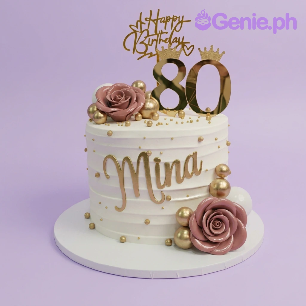 80th Birthday White Floral Cake A white 1 Tier 80th Birthday cake, featuring gold '80' and 'HB' toppers, pink roses, and gold spheres.