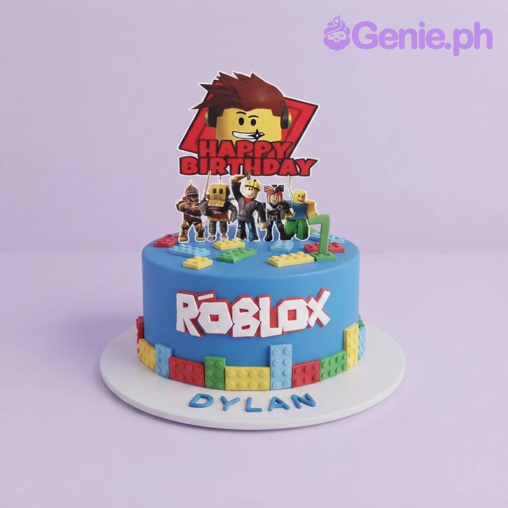 Blue 1-tier birthday cake with Roblox character printouts, edible fondant lego bricks, and a custom name message on the base board Blue 1-tier birthday cake with Roblox character printouts, edible fondant lego bricks, and a custom name message on the base board