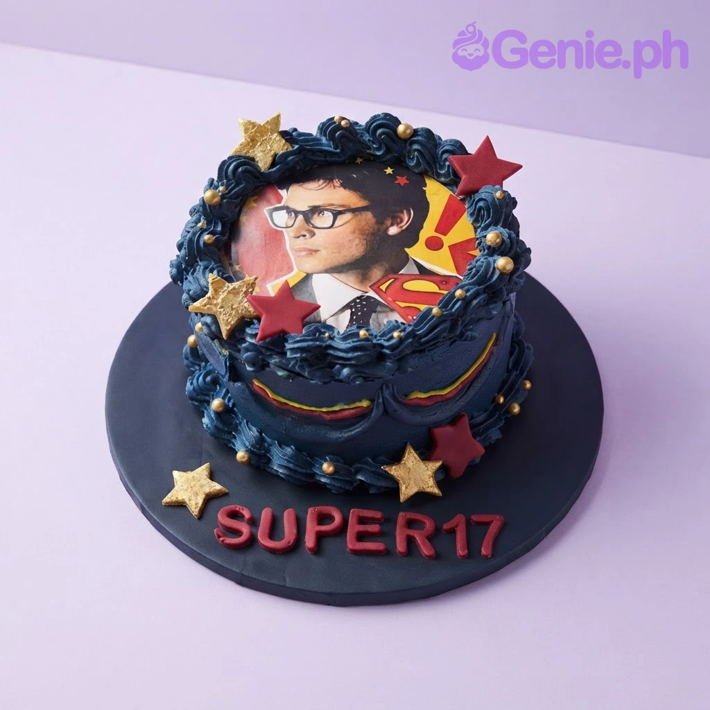 Superhero Memory Navy Birthday Cake Navy blue 1-tier birthday cake with smooth soft icing, edible photo portrait on top, gold and dark red fondant stars, and red message lettering