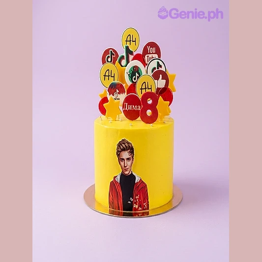 A4 Blogger Yellow Cake One tier yellow cake with circular logo printouts, a number eight, a photo of a person, yellow stars, and a YouTube logo sticker