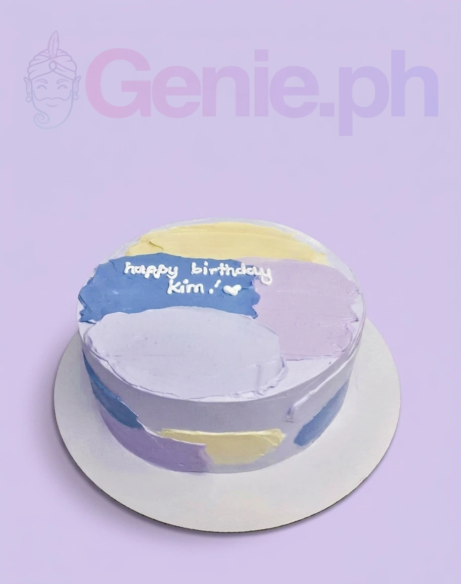 Bento cake with abstract palette knife icing in purple, blue, and yellow with a white birthday message. Bento cake with abstract palette knife icing in purple, blue, and yellow with a white birthday message.