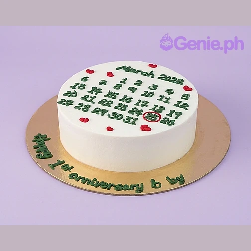 Anniversary Calendar White Heart Cake White 1-tier anniversary cake with a green piped calendar design for March 2028 and red heart accents