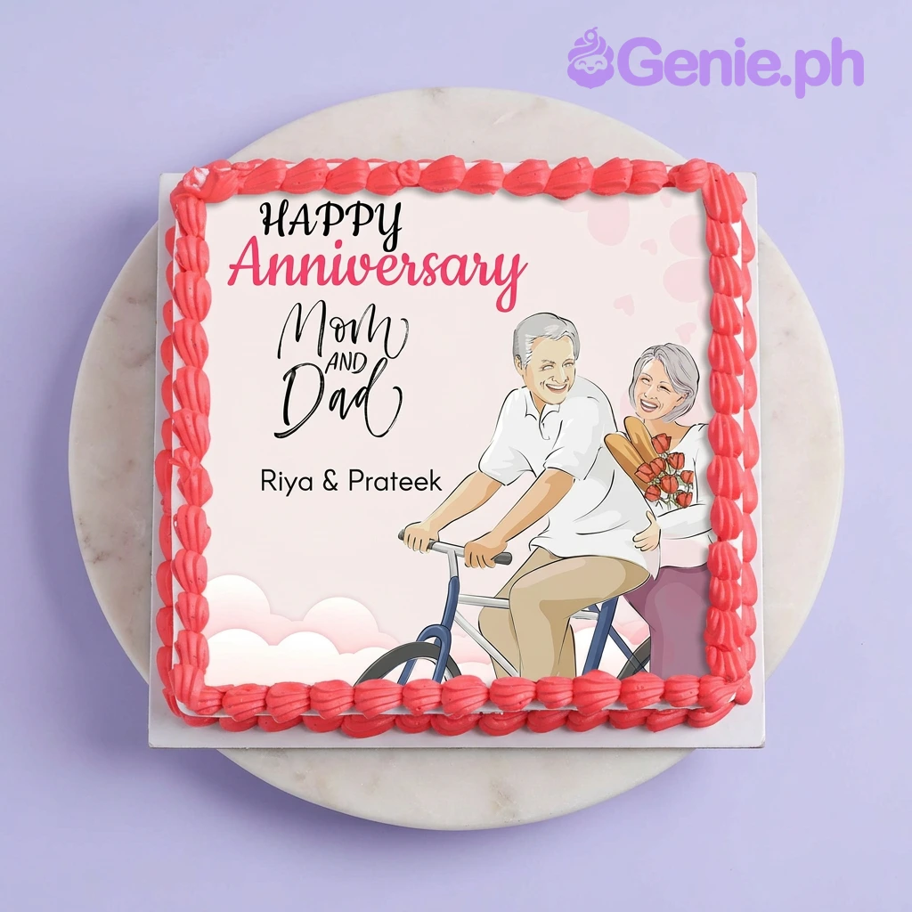 White square anniversary cake with edible photo print of couple on bicycle and red piped icing border