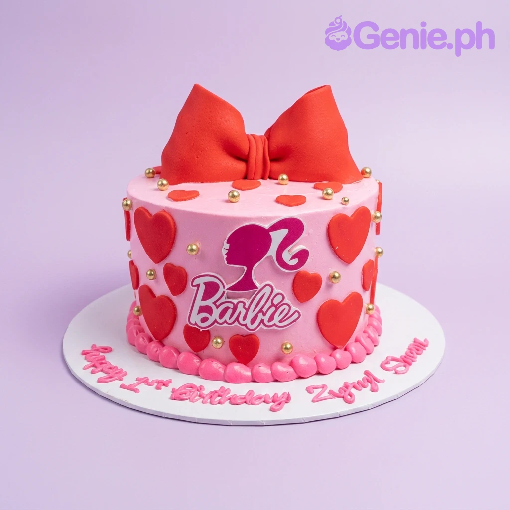 Barbie-Inspired Pink Bow Birthday Cake A pink 1 Tier Barbie themed cake, featuring a red fondant bow, a Barbie logo printout, red hearts, and gold pearls.