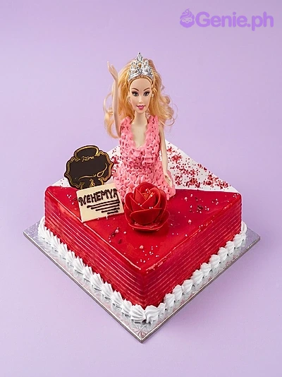 Barbie-Inspired Red Floral Birthday Cake Square red and white Barbie doll cake with a pink icing dress, a silver tiara, and a red rose icing decoration.