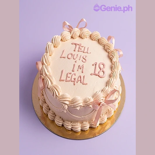 Birthday Ivory Cake Beige 1-tier birthday cake with pink piped message and satin ribbon bows on the edge