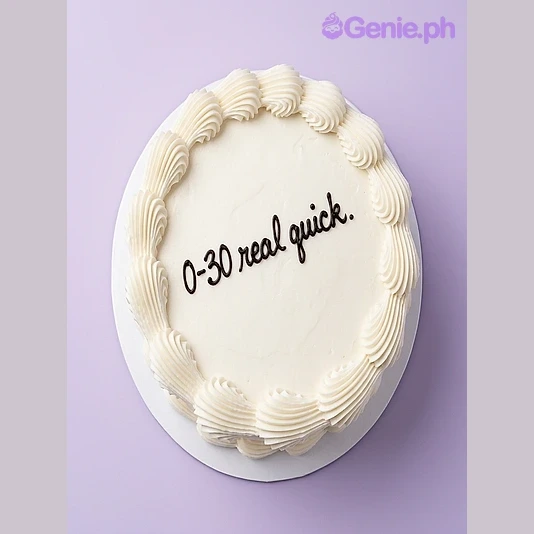 Birthday White Cake White round cake with black piped text 0-30 real quick and white piped border