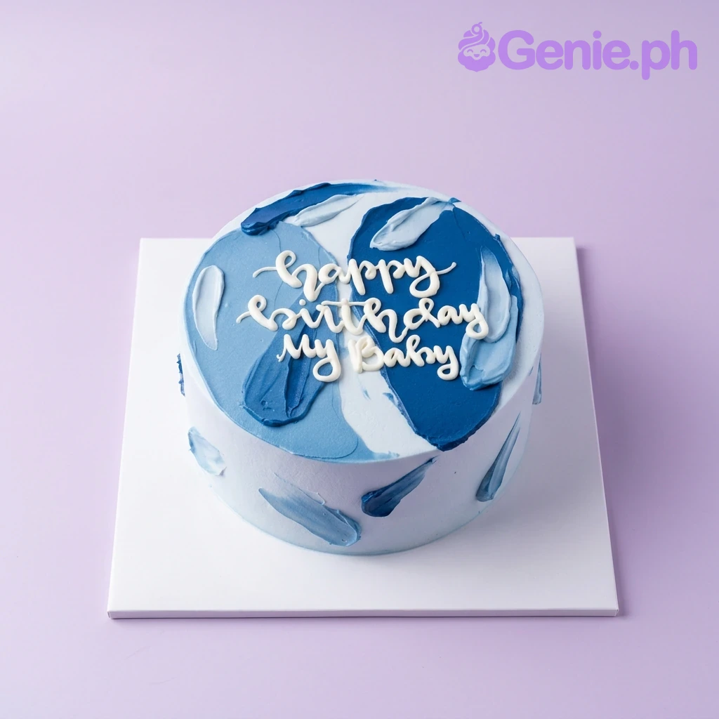 Blue Minimalist Birthday Cake A light blue 1 Tier cake themed around Minimalist design, featuring dark blue palette knife icing strokes and a white piped message.