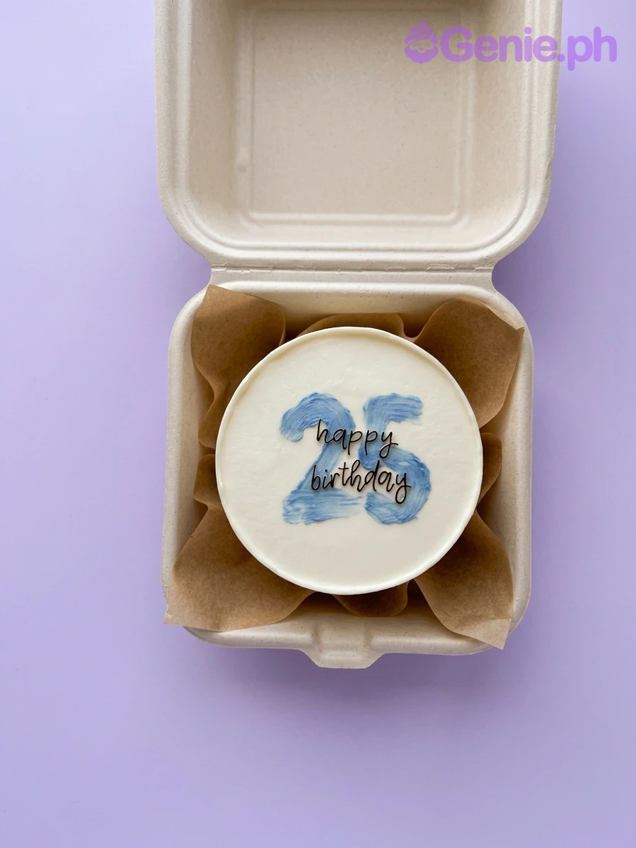 Blue Minimalist White Bento Birthday Cake A white bento cake themed around Blue Minimalist 25th birthday, featuring a blue palette knife number 25 and black 'happy birthday' text.