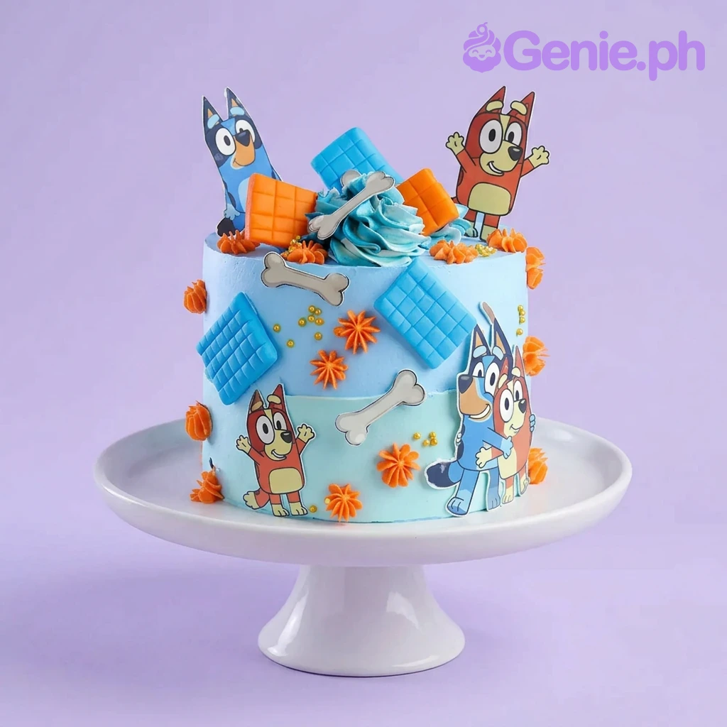 A light blue 1 Tier cake themed around Bluey And Bingo, featuring Bluey and Bingo figures and orange icing rosettes. A light blue 1 Tier cake themed around Bluey And Bingo, featuring Bluey and Bingo figures and orange icing rosettes.