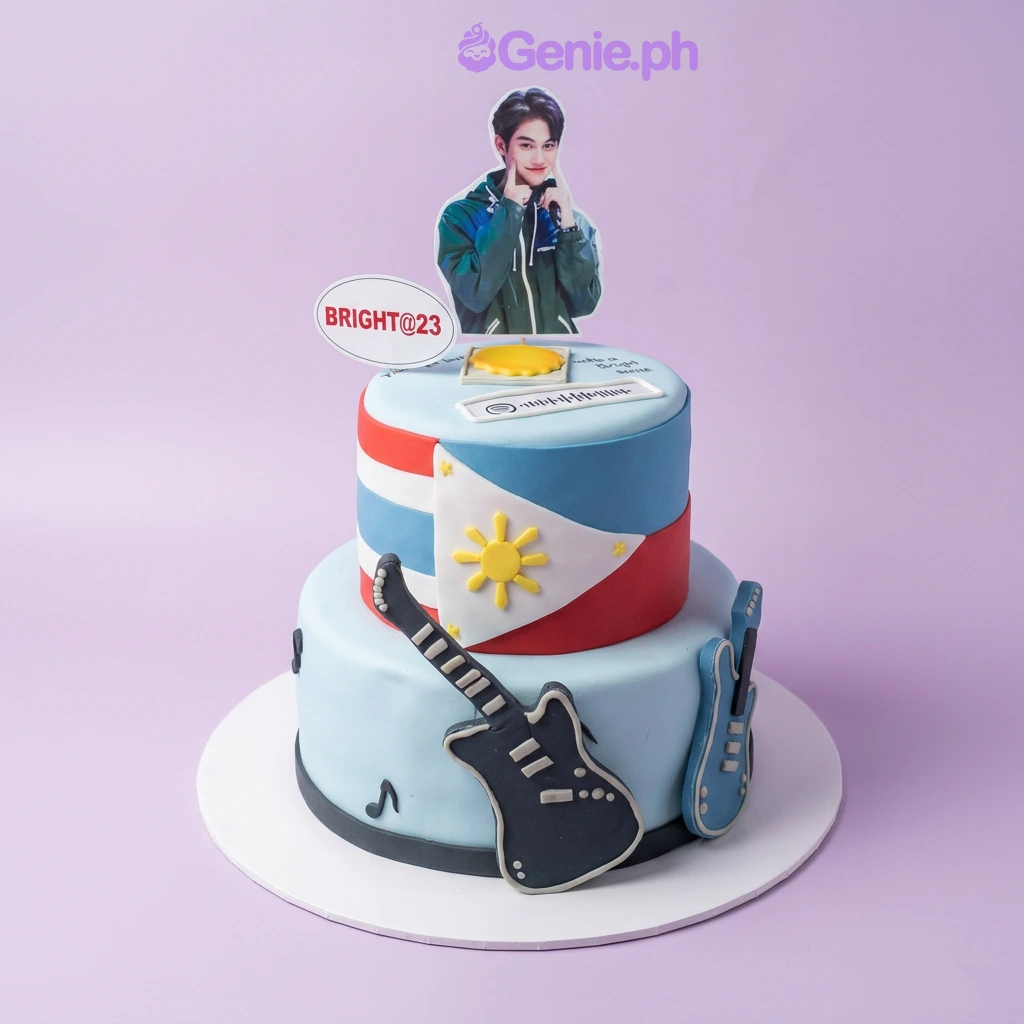 Bright Vachirawit 2-Tier Cake Two tier sky blue fondant cake with a photo of Bright Vachirawit, text sign, Spotify code, Philippine flag, guitars, and sun