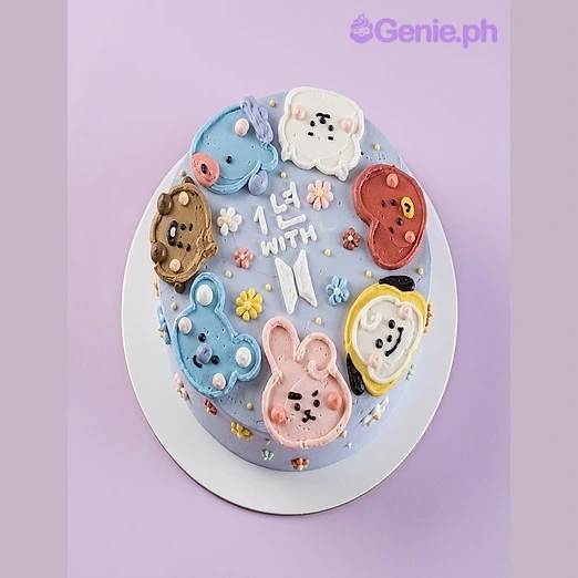 BTS-Inspired Lavender Floral Birthday Cake Lavender 1-tier cake with BT21 character faces and piped flowers