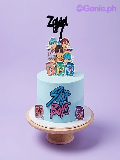BTS Kpop-Inspired Sky Blue Birthday Cake A light blue 1 Tier BTS K-pop cake, featuring a BTS group photo, black name topper, 'BTS BOYS' text, and character icons.