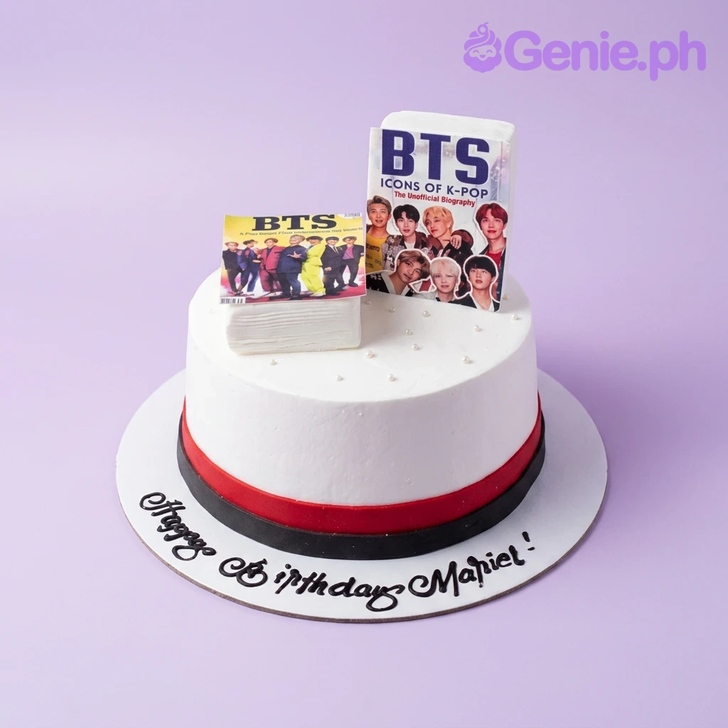 BTS Kpop-Inspired White Birthday Cake White BTS K-pop themed birthday cake with printed book-style toppers and red and black base borders.