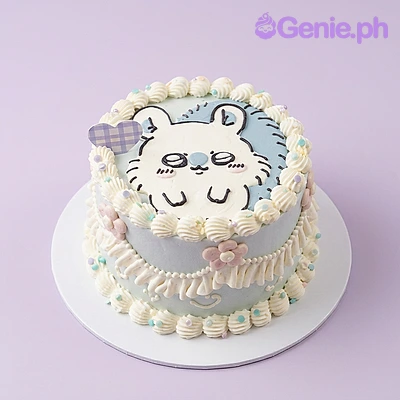 Bunny White Cake One tier white soft-iced cake with a bunny character graphic, a small printed tag, piped icing borders, small flower, pearl, and heart accents