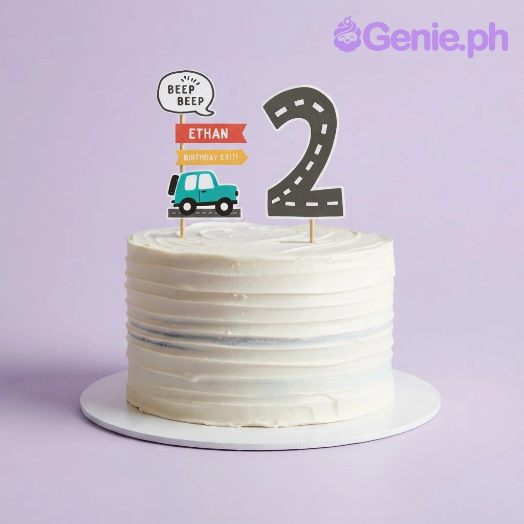 White 1-tier cake with soft icing, car theme printout toppers, and a number two sign White 1-tier cake with soft icing, car theme printout toppers, and a number two sign