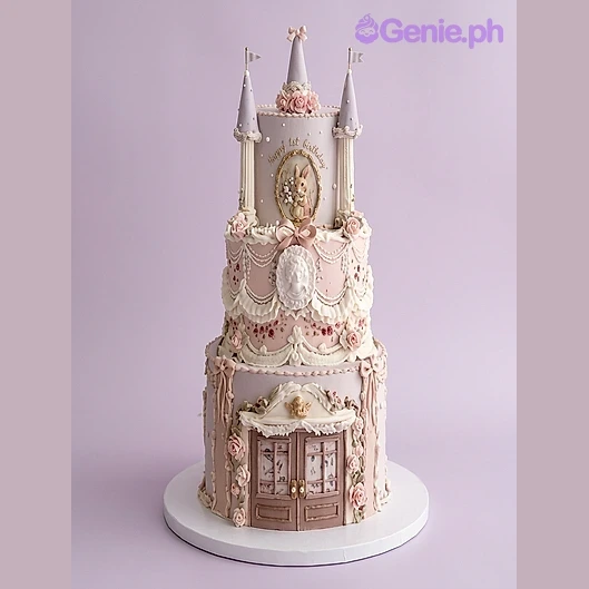 3-tier pink and ivory fondant castle cake with a rabbit graphic, castle towers, and floral decorations 3-tier pink and ivory fondant castle cake with a rabbit graphic, castle towers, and floral decorations