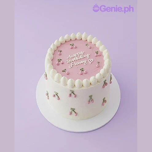 Cherry Birthday Cake White 1-tier birthday cake with pink top and piped red cherry decorations