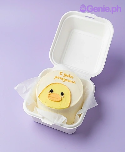 Chick Bento White Birthday Cake A white and yellow Bento cake themed around a chick, featuring an orange beak, black eyes, pink cheeks, and an orange Russian message.