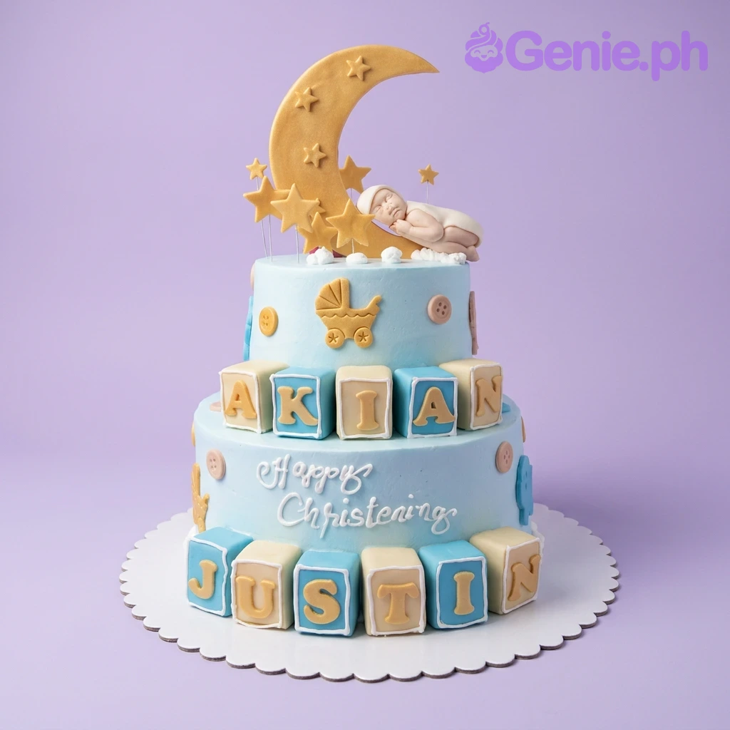 Christening Sky Blue 2-Tier Cake Light blue 2-tier christening cake with a sleeping baby on a crescent moon, yellow stars, and name blocks for Akian Justin.
