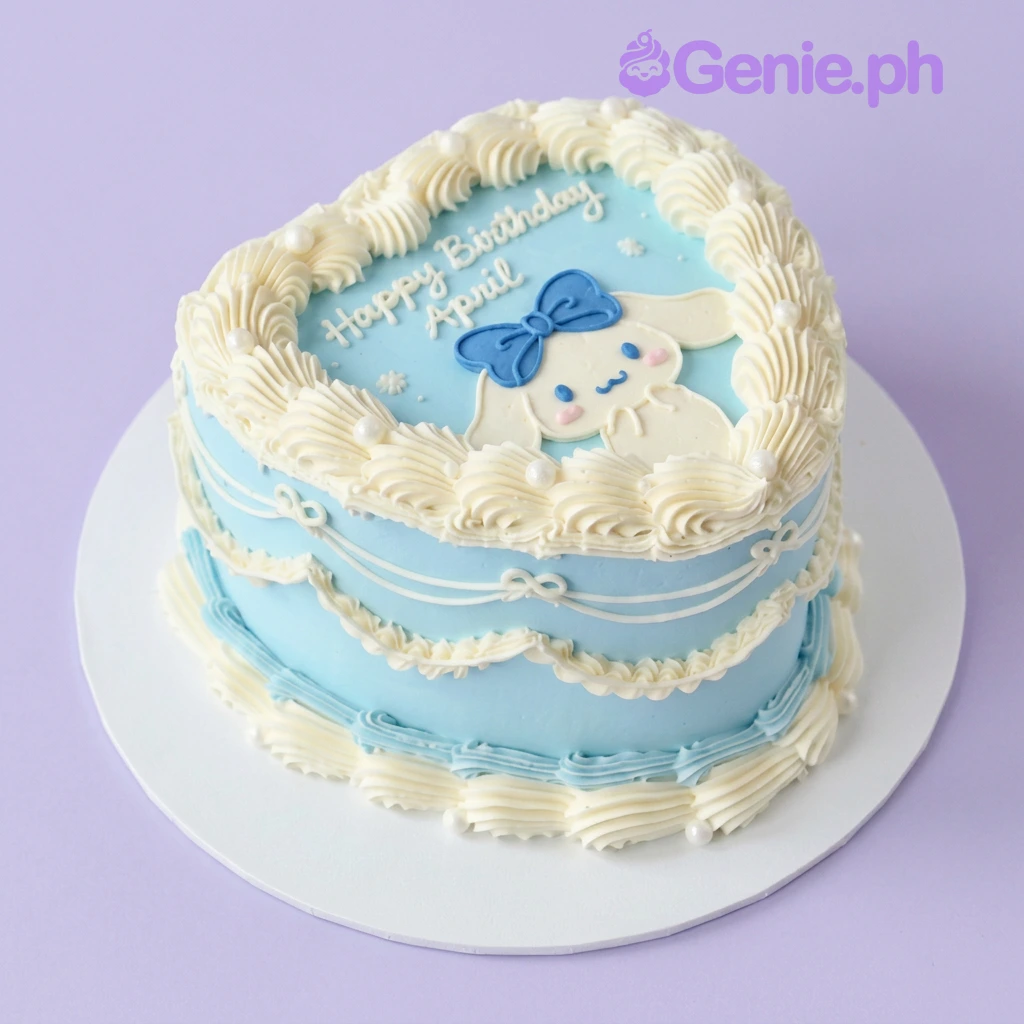 Cinnamoroll-Inspired Heart Sky Blue Birthday Cake Light blue heart-shaped cake with soft icing, a Cinnamoroll character topper, piped white borders, and pearl accents