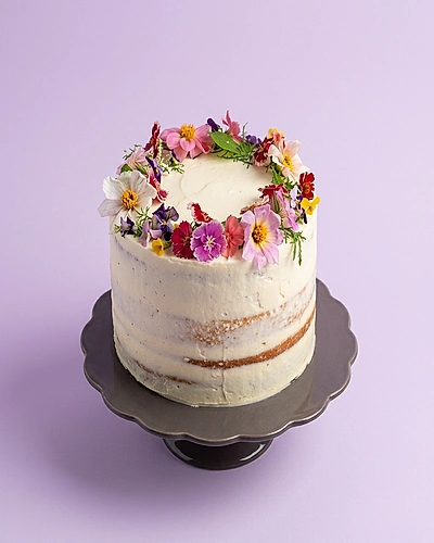 colorful floral 1 Tier - red, cream theme with fresh-looking flowers arranged in a wreath