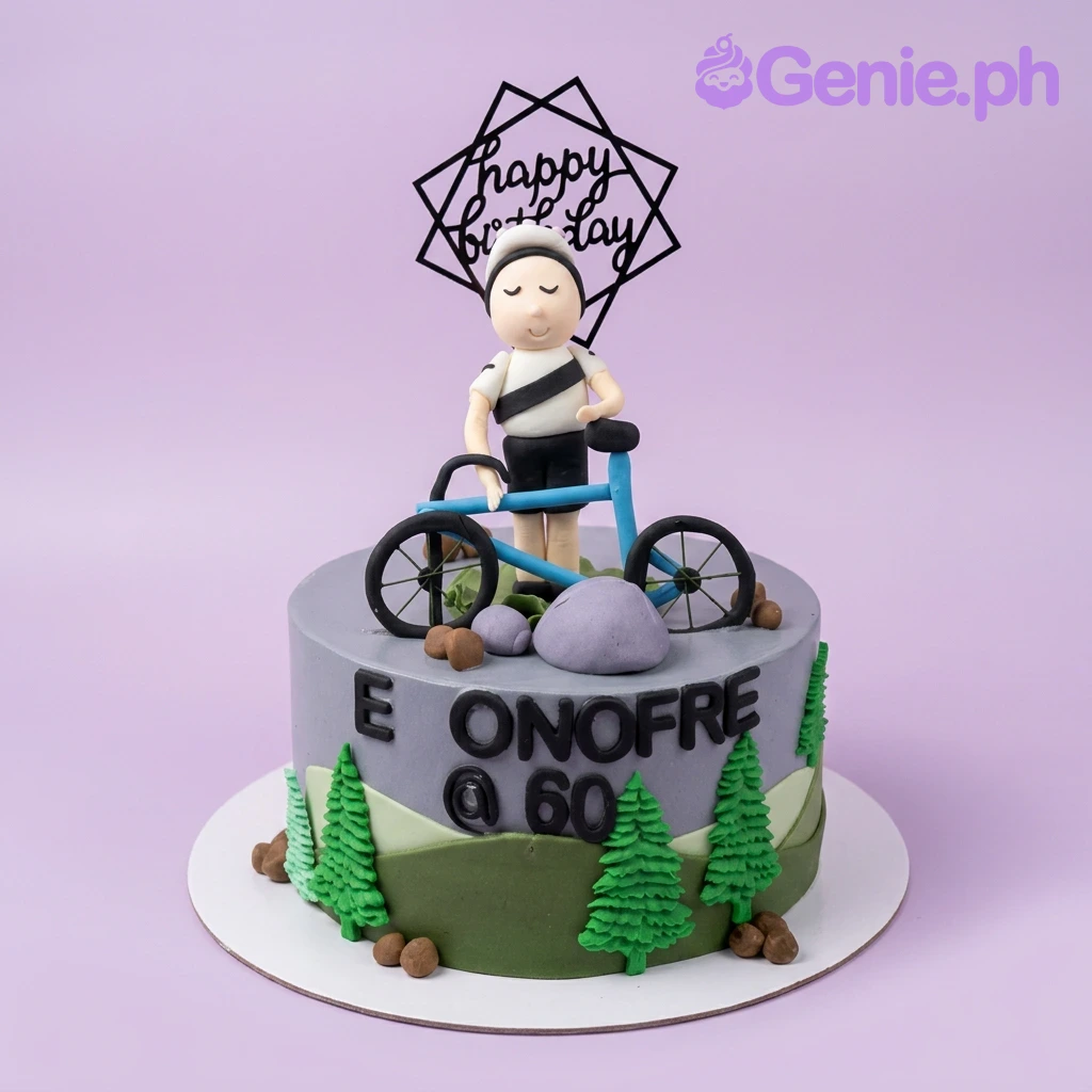 Cyclist Gray Birthday Cake Gray 1-tier cyclist birthday cake with a 3D fondant biker figure, blue bicycle, and green gumpaste pine trees.