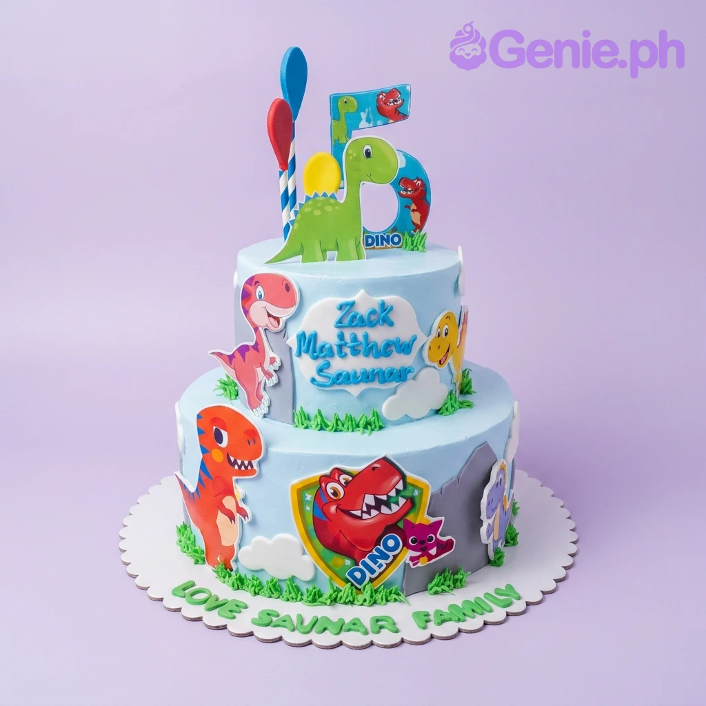 A light blue two-tier Dinosaur cake with a large blue number five, colorful dinosaur printouts, and green icing grass.