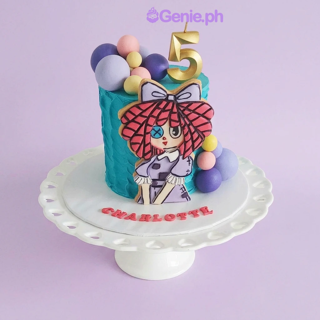 Doll Sky Blue Birthday Cake Blue 1-tier birthday cake with a doll character printout, number 5 candle, and colorful fondant spheres