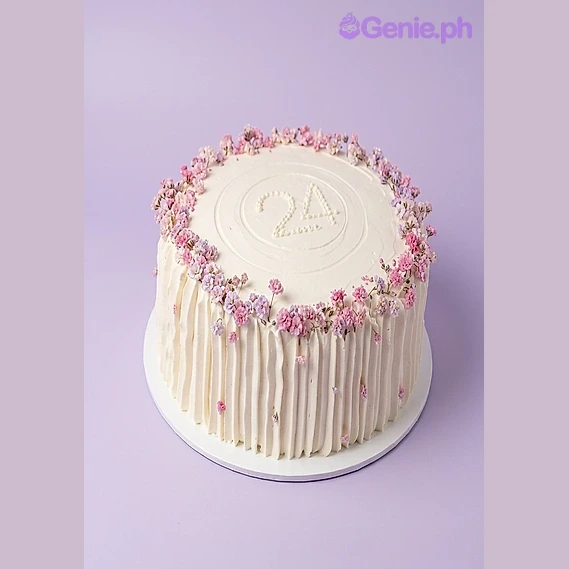 Floral Birthday White Cake White single-tier cake with pink flowers and piped number 24 on top