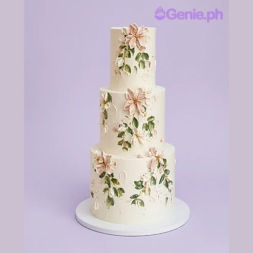 Floral Ivory 3-Tier Cake Ivory 3-tier fondant cake with hand-painted floral icing decorations
