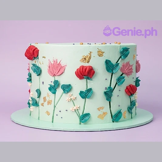 Floral Mint Cake Mint green cake with hand-piped floral palette knife icing and gold leaf accents