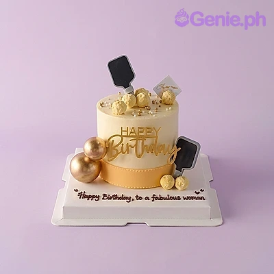 Gold Yellow White Glitter Birthday Cake White and yellow single tier birthday cake with gold Happy Birthday cardstock topper and gold plastic balls
