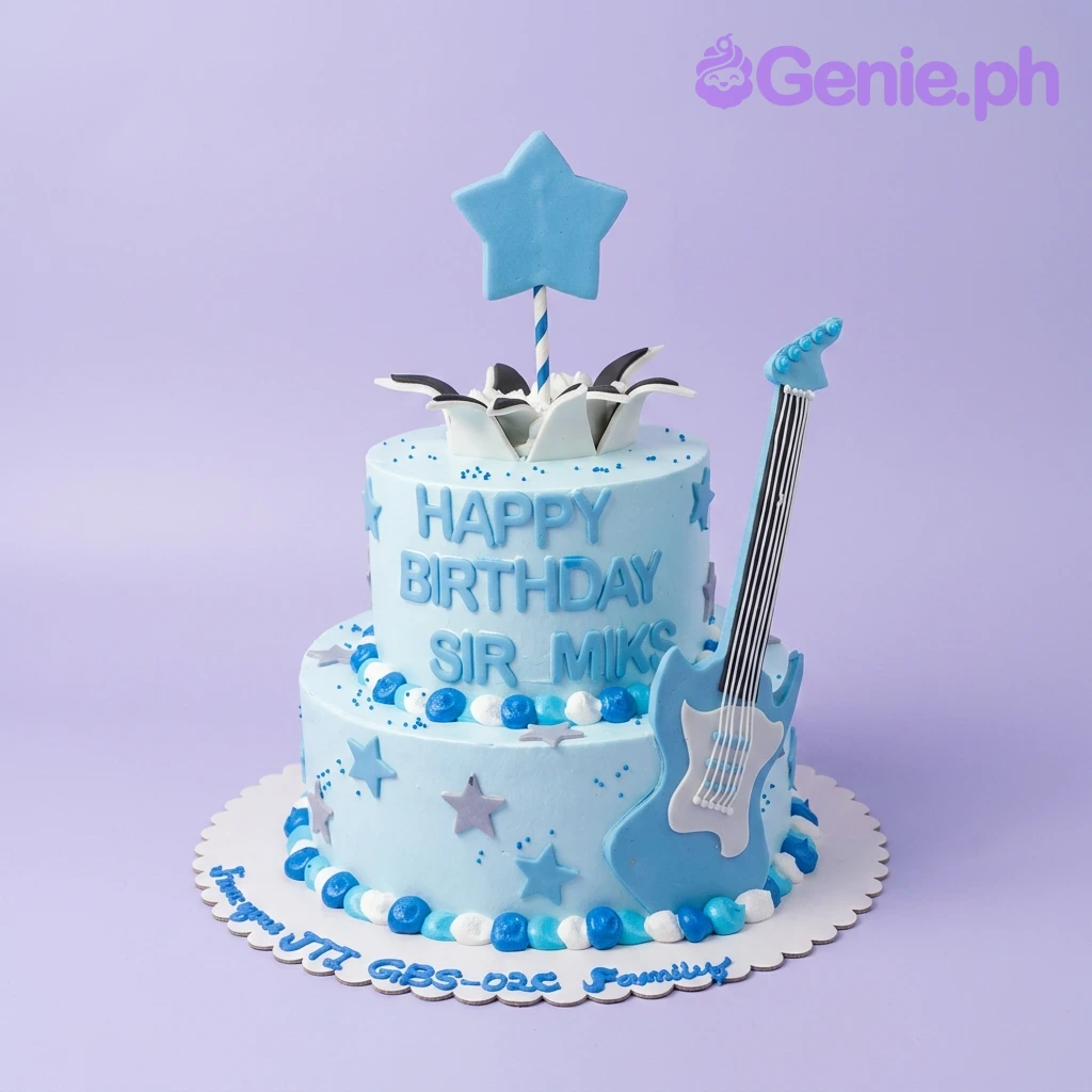 Guitar Birthday Sky Blue 2-Tier Cake A light blue two-tier cake themed around guitar, featuring a blue guitar topper, fondant stars, and blue/white dollops.