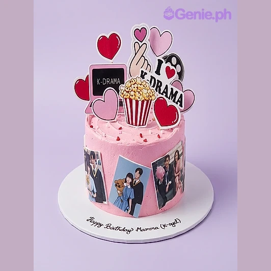 K-Drama Birthday Pink Heart Cake Pink 1 tier cake with K-Drama laptop, finger heart, popcorn, I love K-Drama sign, film reel, heart cutouts, side photos, and red heart sprinkles