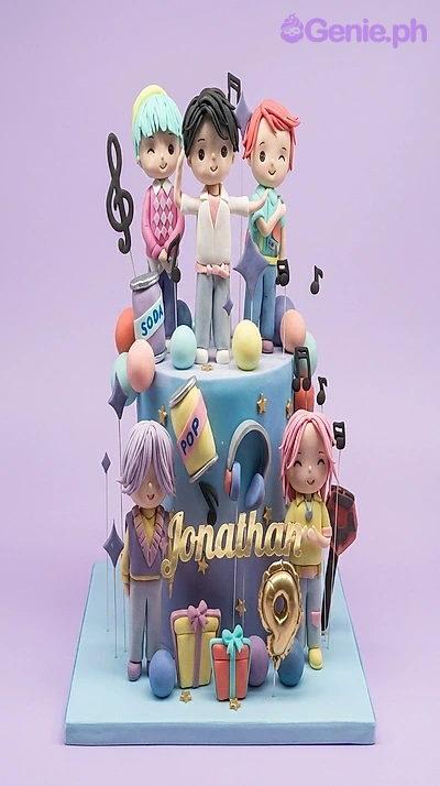 K-Pop-Inspired Boy Band 2-Tier Birthday Cake A blue and purple two-tier fondant cake themed K-Pop Boy Band, featuring five boy band figures, musical notes, and soda cans.
