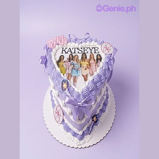 Katseye-Inspired Kpop Heart Cake Lavender heart-shaped cake with Katseye group photo print and purple piped icing borders