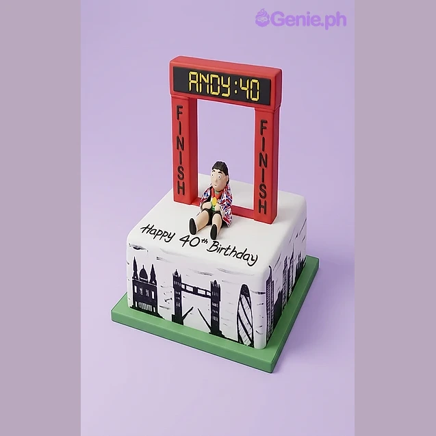 Marathon Birthday White Silhouette Cake White square fondant cake with a London skyline silhouette, a runner figurine, and a red finish line arch topper for a 40th birthday
