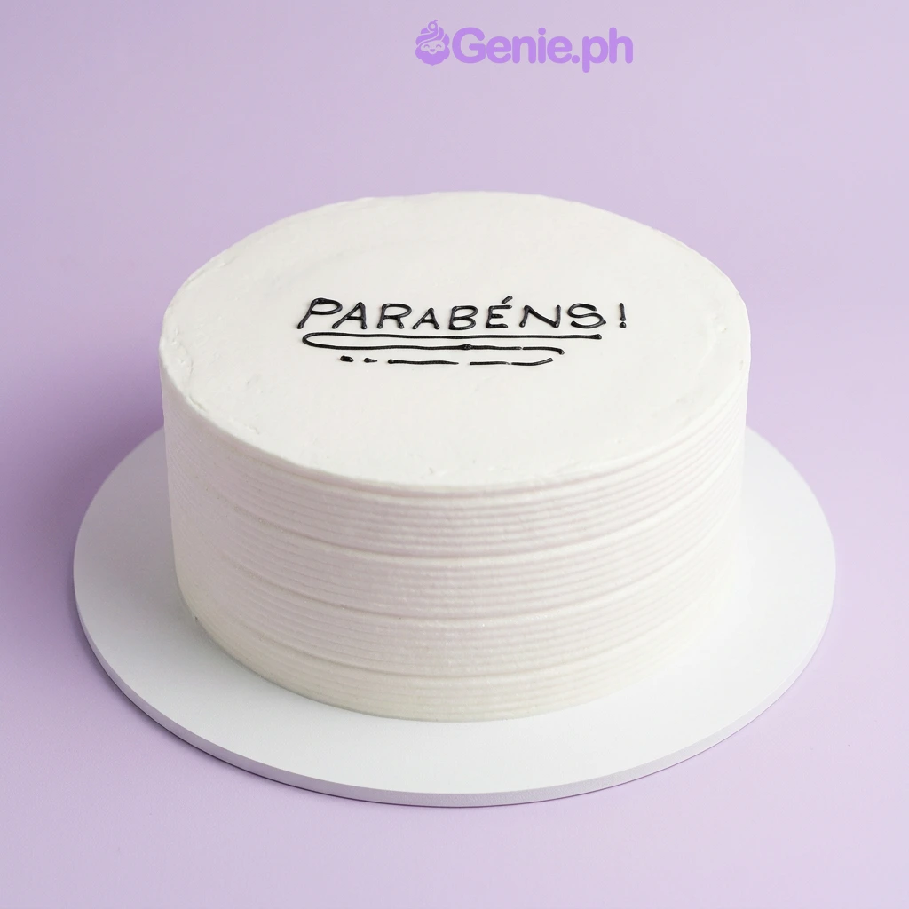Minimalist Birthday White Cake A single tier white soft-iced cake with black icing text and a piped logo on the board