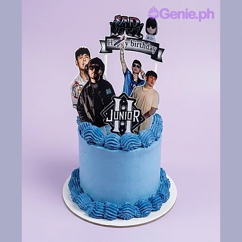 Music Birthday Sky Blue Cake Single tier cake with sky blue icing, Happy Birthday banner, multiple photos, Junior logo, character printout, and piped blue borders