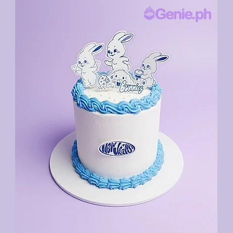 NewJeans White Birthday Cake White 1-tier cake with NewJeans bunny printout toppers and blue piped borders