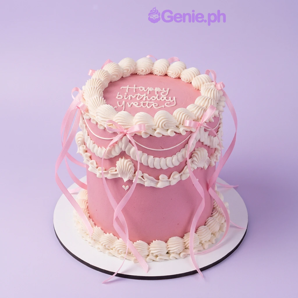 Pink Birthday Cake Pink 1-tier birthday cake with white piped icing swags and pink satin ribbon bows