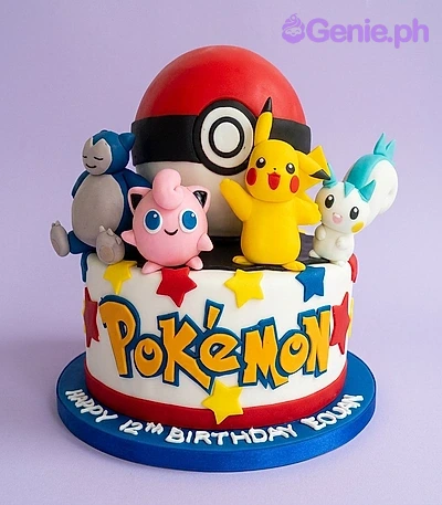 A white fondant cake featuring a Pokeball, Pikachu, Snorlax, Jigglypuff, and Pachirisu figures and colorful fondant stars.
