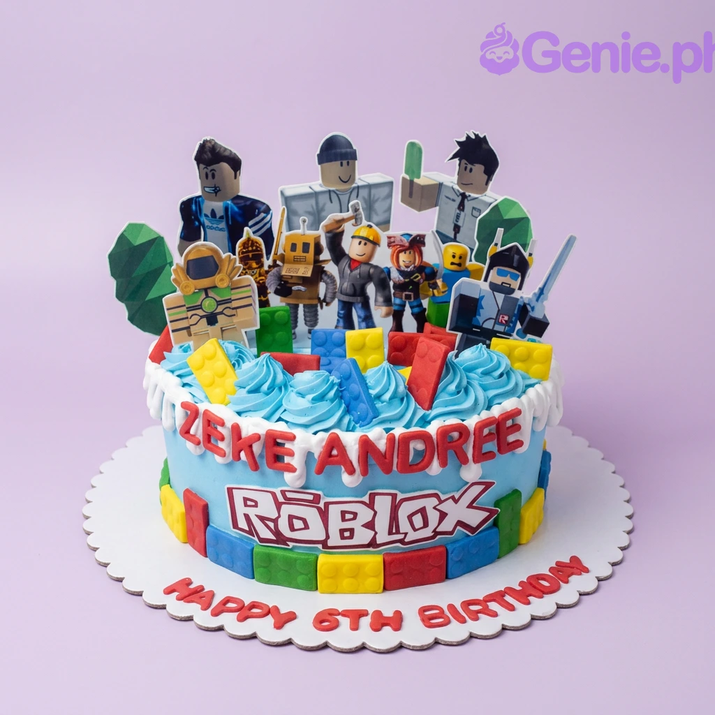 A light blue 1-tier cake themed around Roblox, featuring character and logo cutouts, colorful building blocks, and red lettering.